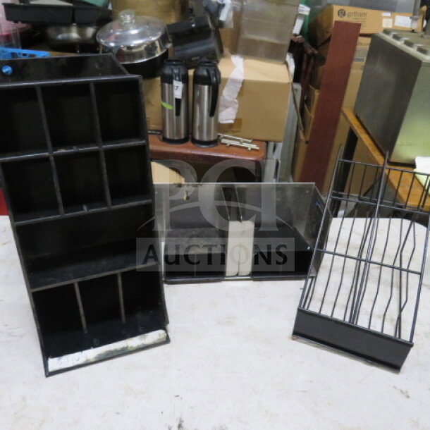 Assorted holders, three types: metal and plastic, varying sizes and compartments, used condition, suitable for organizing.