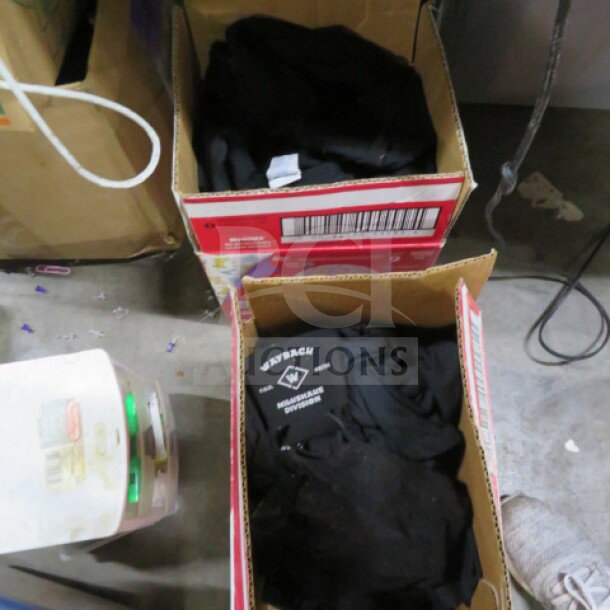 One lot of assorted black shirts in cardboard boxes, one labeled "WEYBACH Industries Division." Shirts appear gently used.