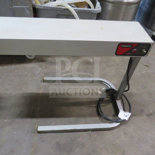 Nemco 6152-24 warmer in good condition, 120V. Features include a metal frame and power cord, ideal for commercial use.