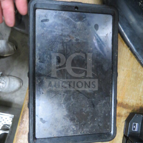 Samsung tablet with protective case, screen shows visible wear, sold without cords.