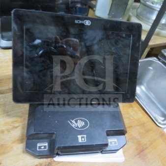 NCR POS terminal with stand, no cords, black, visible NFC icons, used condition.