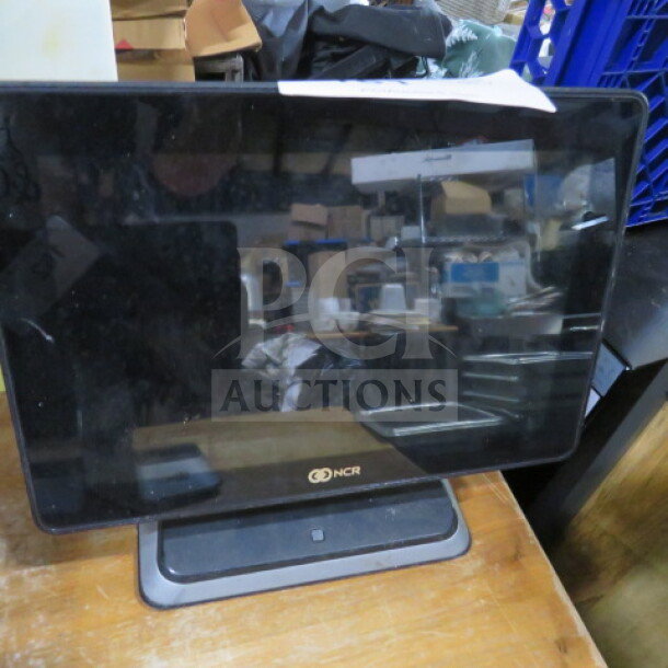 NCR POS terminal without cords, display screen, used condition, NCR logo visible on the bezel.