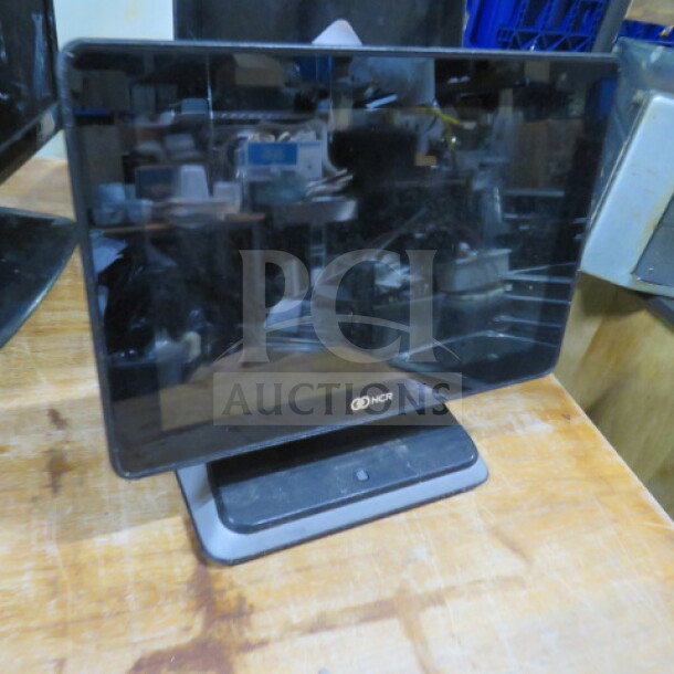 NCR POS Terminal, no cords, touchscreen, black, clean condition, model and serial number not visible.