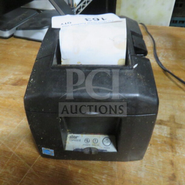 Star TSP650 thermal printer, black, used condition, visible wear. Model label indicates "Star TSP650".