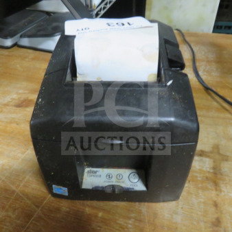 Star TSP650 thermal printer, black, used condition, visible wear. Model label indicates "Star TSP650".