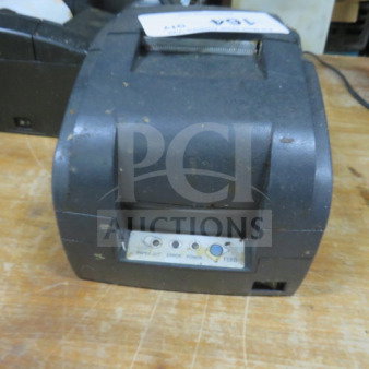 Bixolon thermal printer, pre-owned, with visible wear, control panel showing power and feed buttons. Model unspecified.