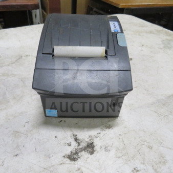 Bixolon thermal printer, used condition, showing control panel, paper slot, and power switch. Minor surface wear visible.