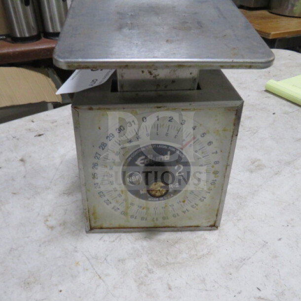 Edlund SR-2 scale, metal body, visible wear, model label reads "#SR-2", NSF certification, round dial with measurements.