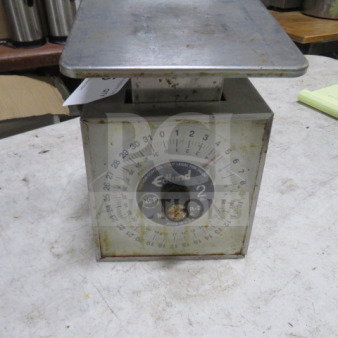 Edlund SR-2 scale, metal body, visible wear, model label reads "#SR-2", NSF certification, round dial with measurements.