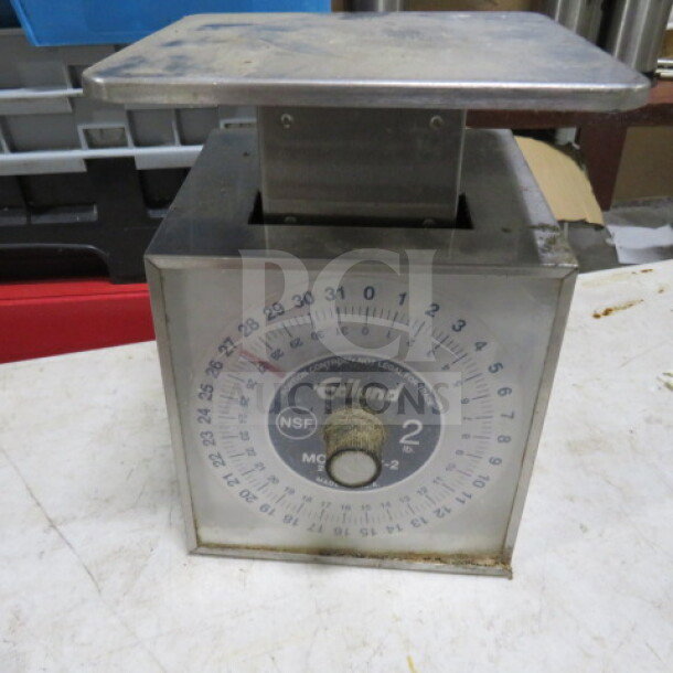 Edlund SR-2 scale with stainless steel platform, visible markings, and dial. Used condition with some surface wear.