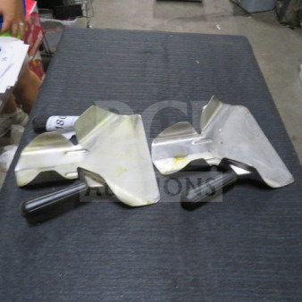 Two metal fry scoops with black handles on a dark surface. Slight wear visible, model 2XBID.
