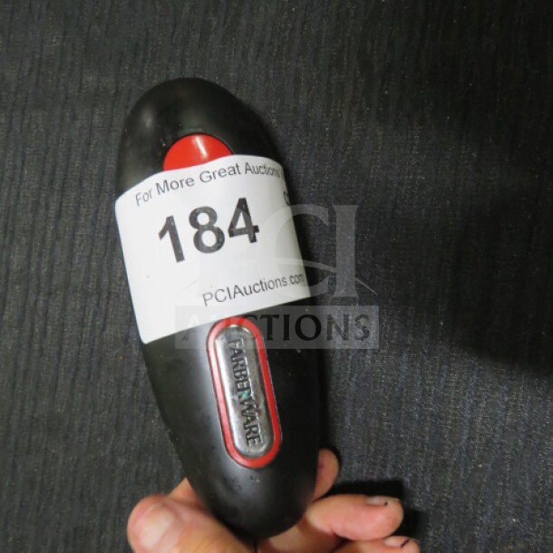 Farberware can opener, black with red accents, ergonomic grip, visible auction label number 184, used condition.