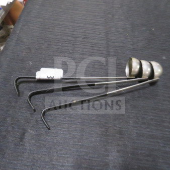 1oz stainless steel ladle, model 3XBID, featuring a polished bowl and long handle. Good condition, slight wear visible.