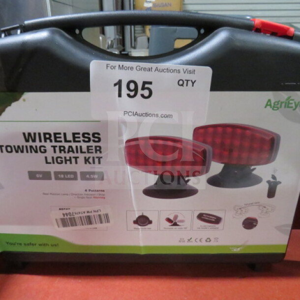 Wireless Trailer Towing Light Kit in original packaging; red LED lights; includes carrying case; item number 195 visible.