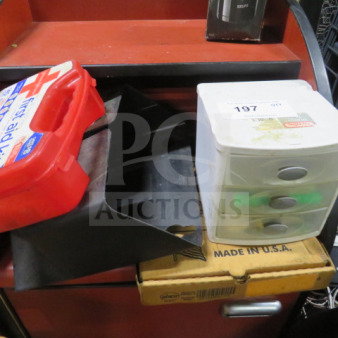 One Lot of Miscellaneous: Includes a red first aid kit, black metal brackets, small plastic drawer organizer, and a cardboard box marked "Made in U.S.A." Condition varies.