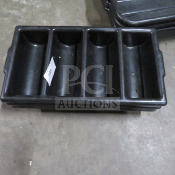Black plastic flatware holder with four compartments, used condition, labeled with item number.