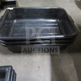 Black plastic bussing tub, model 3XBID, stackable with grip handles, used condition, minor scuffs and wear.