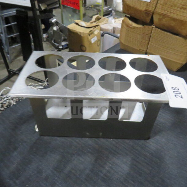 Stainless steel cone holder with eight slots, rectangular design, used condition, item tag number 208 visible.