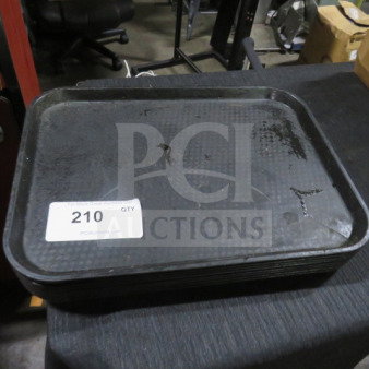 Poly Tray, stack of 8, used condition. Label reads "210 QTY" indicating quantity. Black textured surface.