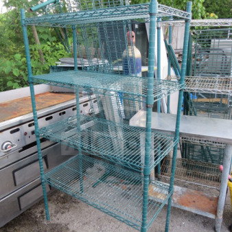 Green Metro shelf unit with four mesh shelves, 36x18x63 inches. Durable metal, good condition, ideal for storage.