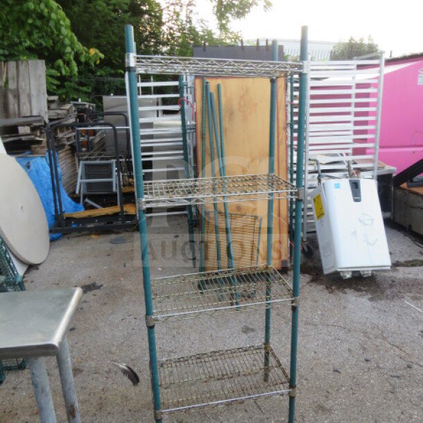 METRO wire shelf unit, 4 adjustable shelves, 24x14x65 inches. Sturdy metal frame, outdoor setting, good condition.