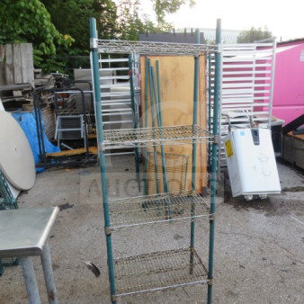 METRO wire shelf unit, 4 adjustable shelves, 24x14x65 inches. Sturdy metal frame, outdoor setting, good condition.