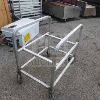Aluminum cart on casters, 18.5x26x27 inches, used condition. Sturdy metal frame, ideal for transporting items.