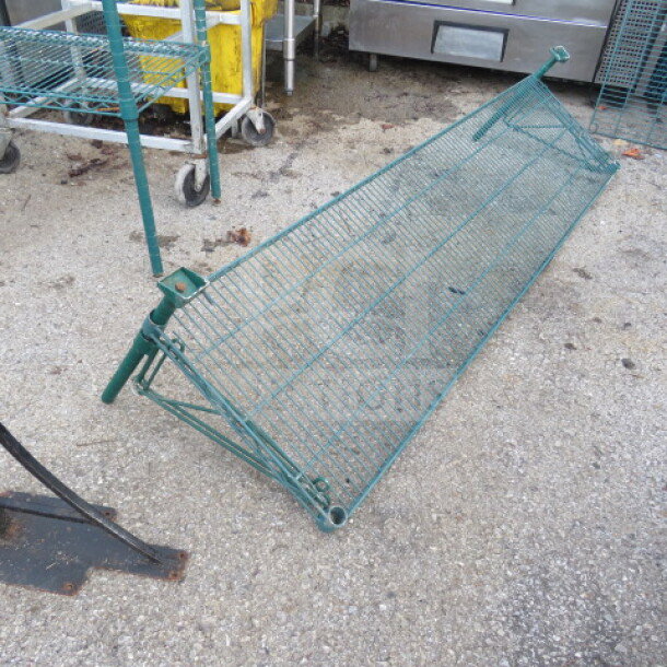 Green Metro shelf with two wall mount brackets, 72x18 inches, sturdy wire construction, minor wear visible.