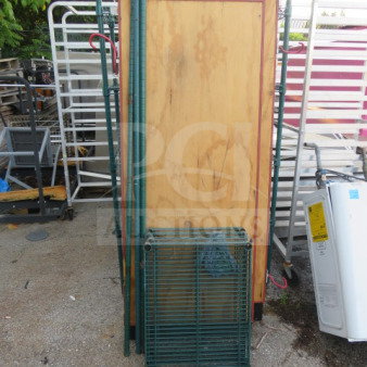 Green Metro shelving unit, unassembled, with 4 shelves. Includes metal poles. Dimensions: 24x18x64 inches.