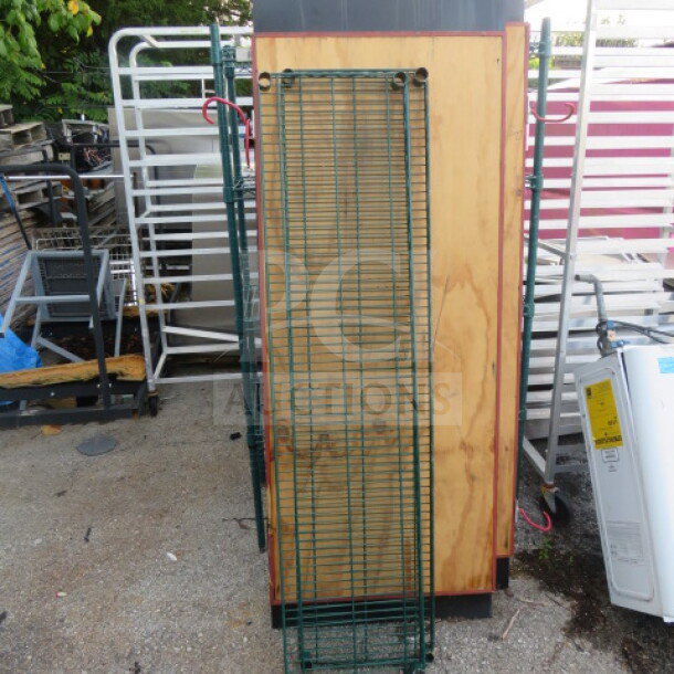 Green Metro shelf, 60x14 inches, wire construction. Used condition, located outdoors amidst other metal equipment.