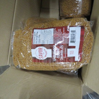 Bag of Savor Imports Speculoos Cookie Crumbles in a case, labeled with nutritional information and weight.