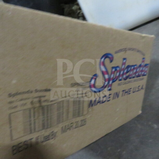 Opened case of Splenda sweetener with bold logo and "Made in the USA" marking; barcode and "Best By: Mar 21, 2026" label visible.