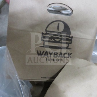 Stack of Wayback Burgers paper bags, featuring burger logo and carry handle, in new condition.