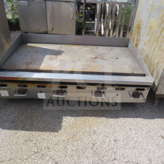 Wolf Natural Gas Griddle, Model GM-48, measures 48x31x15 inches. Shows signs of use. Four control knobs.