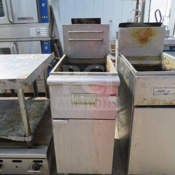 One Katom Natural Gas Deep Fryer, Model F3-P, measuring 15.5x30x46 inches, showing signs of use, with visible branding.