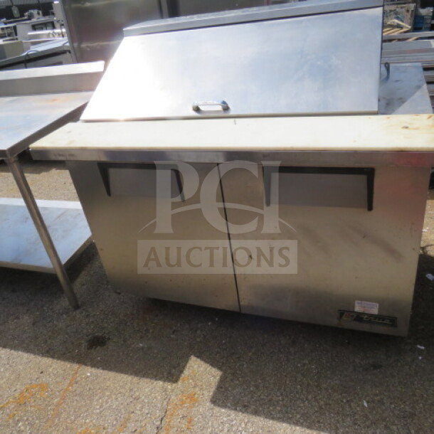 True 2 Door Prep Table, model TSSU-48-18M-B, with cutting board on casters, 48x34x46 inches, 115 volt.
