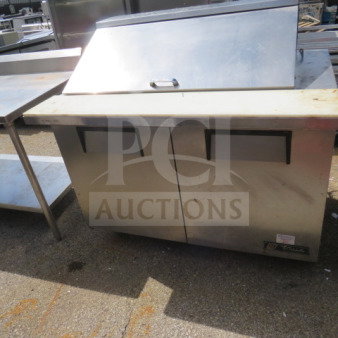 True 2 Door Prep Table, model TSSU-48-18M-B, with cutting board on casters, 48x34x46 inches, 115 volt.