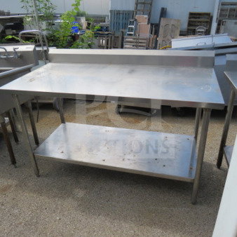 Stainless steel table with under shelf and backsplash, 60"x30"x40", used condition.