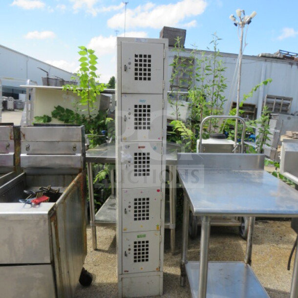 Winholt metal locker system, model WL-55, featuring five lockers, dimensions 12x12x66.5 inches, shown outdoors.