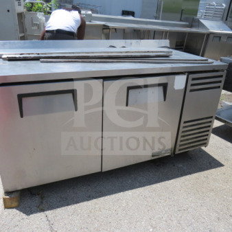 Atosa 2 Door Freezer, Model MGF8406, with 2 racks on casters. Dimensions 48x30x37. Stainless steel, good condition.