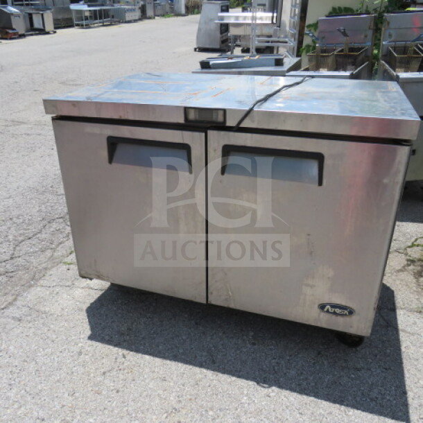 Atosa 2-door freezer model MGF8406 with 2 racks on casters, stainless steel, 48x30x37 inches, used condition.