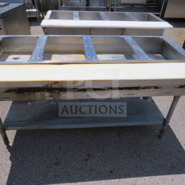 Eagle 4-well steam table with under shelf and cutting board, 64x30.5x34 inches, used condition.