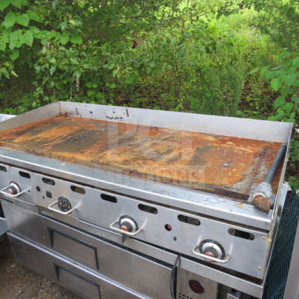 Vulcan natural gas griddle, 60x30x16 inches, stainless steel, visible rust on cooking surface, used condition.