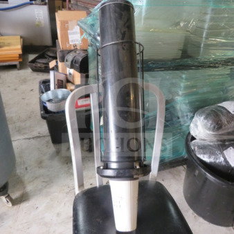 Dispense Rite SLR-2F spring-loaded cup dispenser in black, used condition, with visible surface wear. Model #SLR-2F.