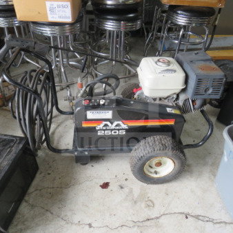 MI-T-M Corporation 2505 pressure washer with hose, used condition, visible brand logo, and model number on the side panel.