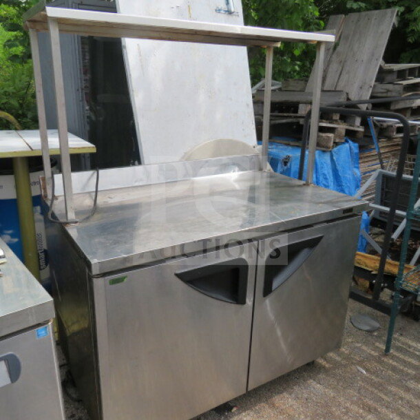 Turbo Air TWR-48SD-N 2 Door Worktop Refrigerator with stainless steel overshelf, 2 racks, on casters, 48x30x64 inches.