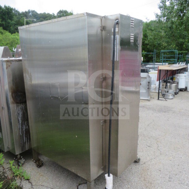 Cookshack SM-360 Smart Smoker, stainless steel, on casters. Dimensions: 48x39x71 inches. 240V, 6000W, used condition.