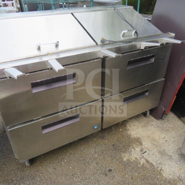 Hoshizaki CRMR60-24MD4 refrigerated prep table with 4 drawers, stainless steel, on casters, in working condition.