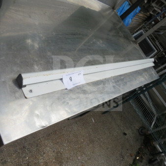 48-inch ticket rail, metal, pre-owned. Features mounting holes and minor wear marks. Auction tag marked "9."