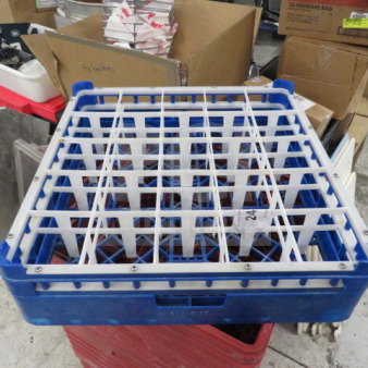 Blue dishwasher rack with 25 compartments, square grid design, sturdy plastic frame, used condition. Ideal for commercial use.